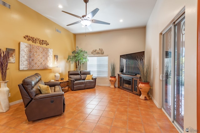 living room with light tile patterned floors and ceiling fan