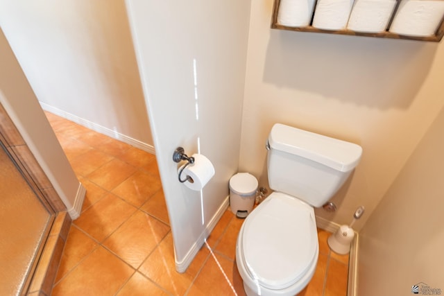 bathroom featuring tile patterned flooring and toilet