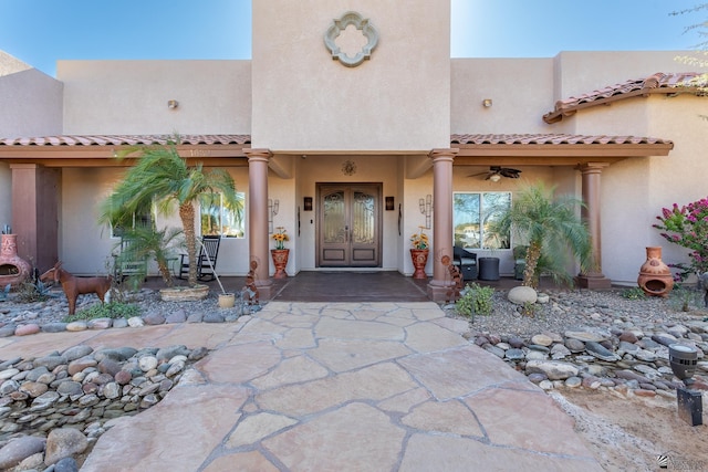 doorway to property featuring ceiling fan