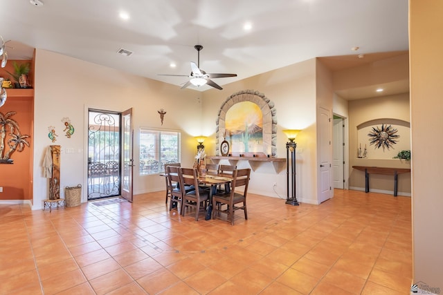 dining room with light tile patterned flooring and ceiling fan