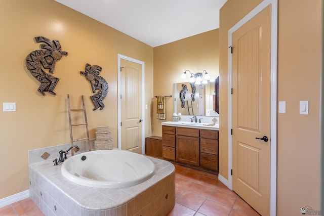 bathroom with a relaxing tiled tub, tile patterned floors, and vanity