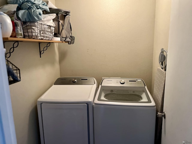 clothes washing area with laundry area and washing machine and dryer