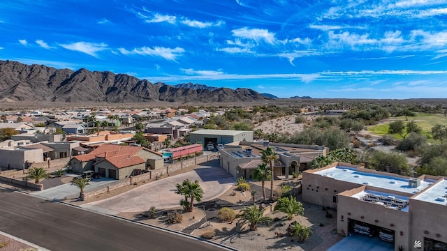 birds eye view of property with a residential view and a mountain view