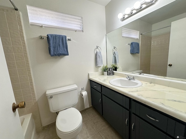 full bathroom featuring toilet, vanity, tile patterned floors, and tiled shower / bath