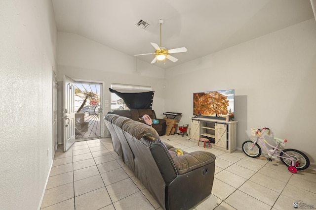 tiled living room with high vaulted ceiling and ceiling fan