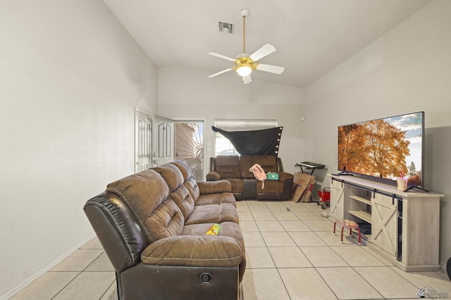 tiled living room with ceiling fan and vaulted ceiling