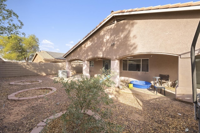 back of property featuring a patio