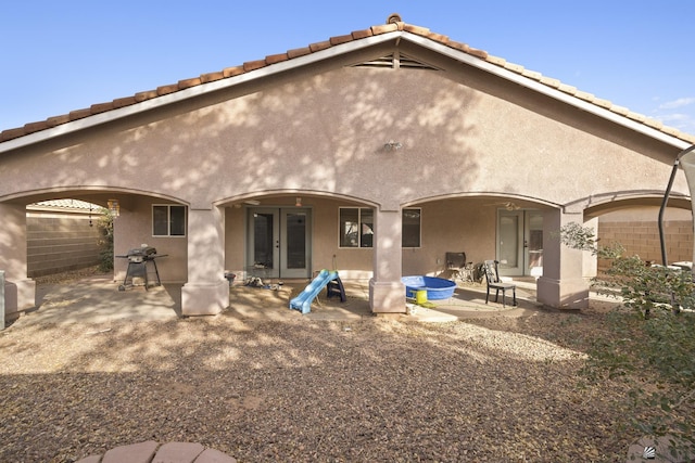 back of house with a patio and french doors