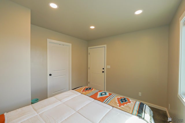 bedroom featuring recessed lighting and baseboards