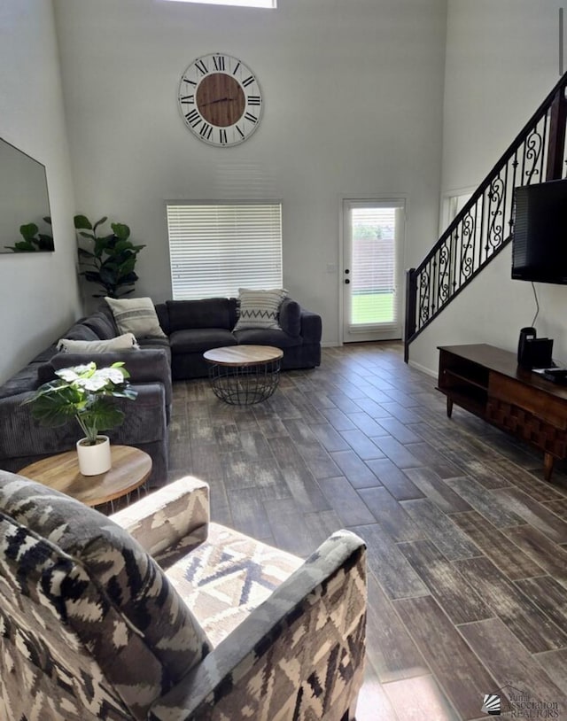 living room with a high ceiling