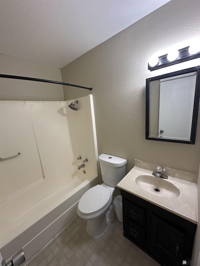 bathroom with vanity, a textured ceiling, shower / bathing tub combination, toilet, and a textured wall