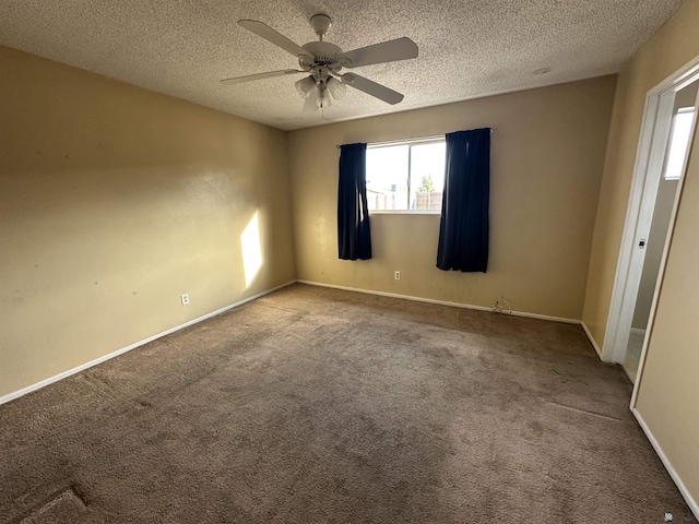 unfurnished bedroom with baseboards, carpet floors, a textured ceiling, and ceiling fan