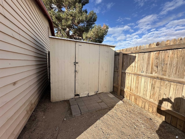 view of shed with fence