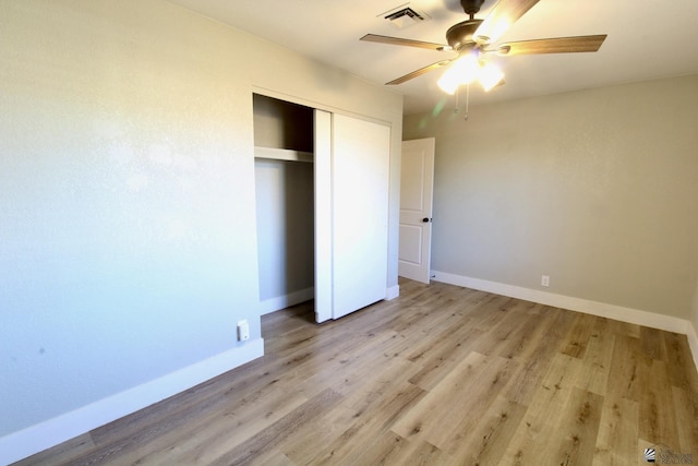 unfurnished bedroom with a closet, ceiling fan, and light hardwood / wood-style floors