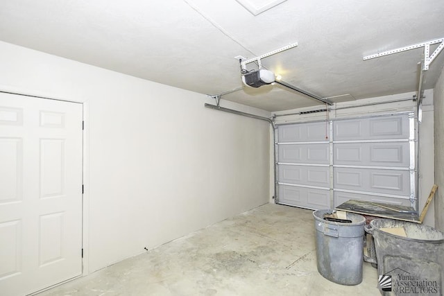 garage featuring a garage door opener