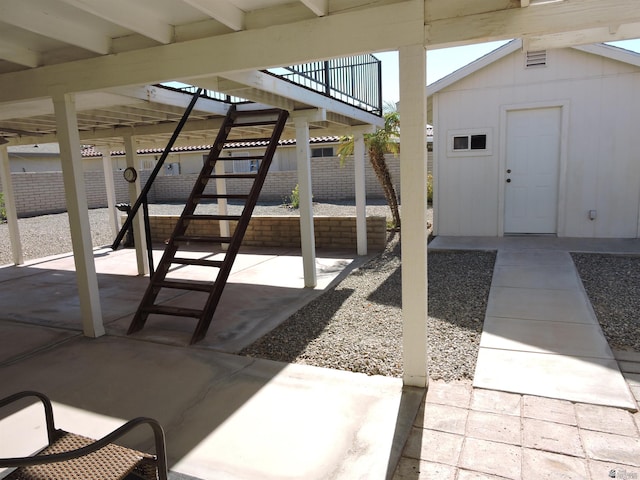 view of patio / terrace with a storage unit