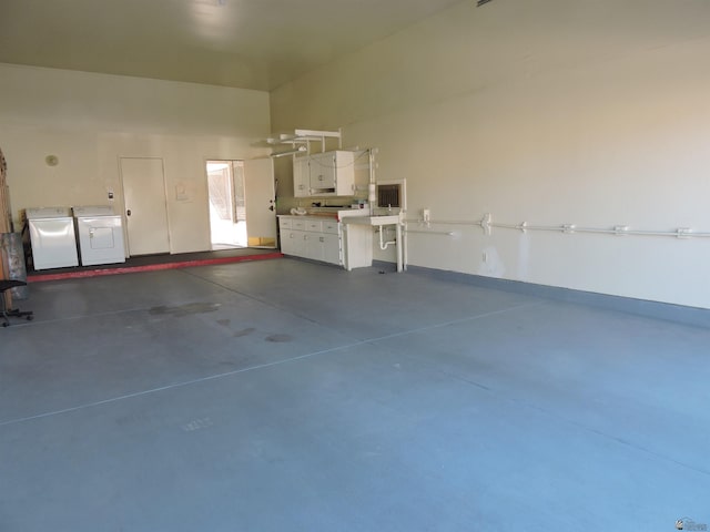 garage with washer and clothes dryer