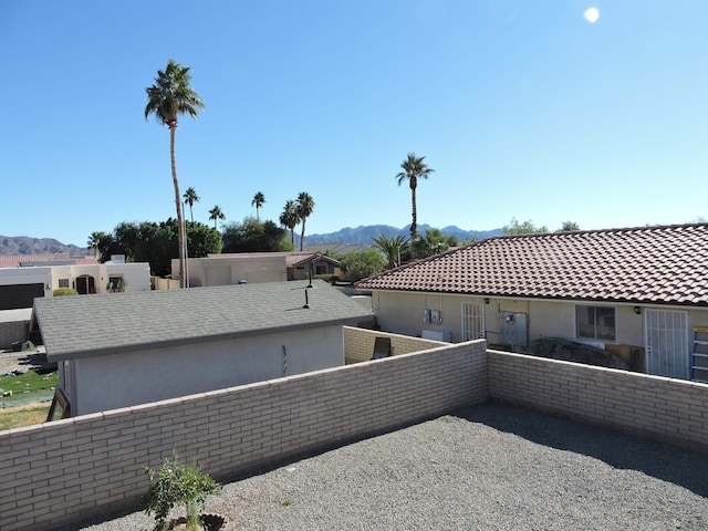 view of side of property with a mountain view