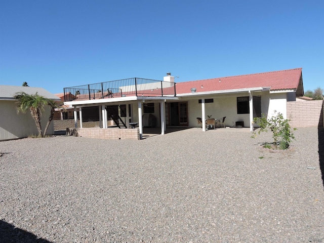 back of property featuring a patio