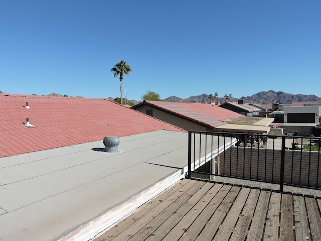 wooden deck with a mountain view