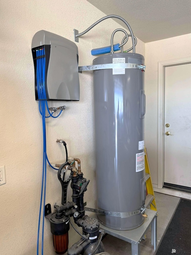 utility room featuring strapped water heater