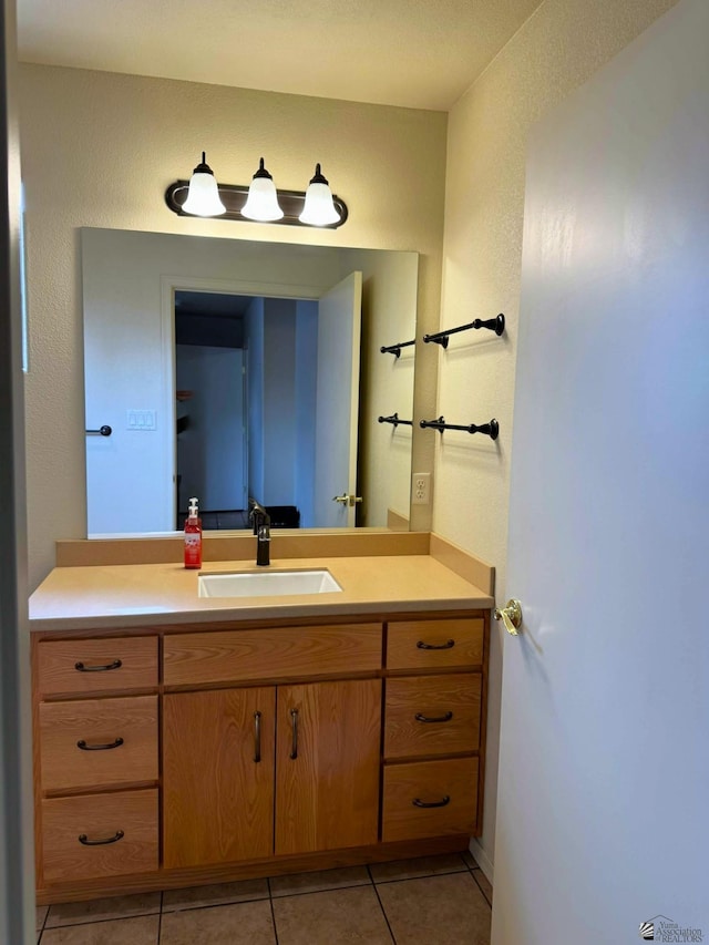 bathroom with vanity and tile patterned floors