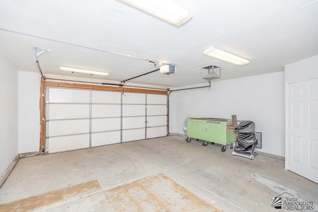 garage featuring a garage door opener