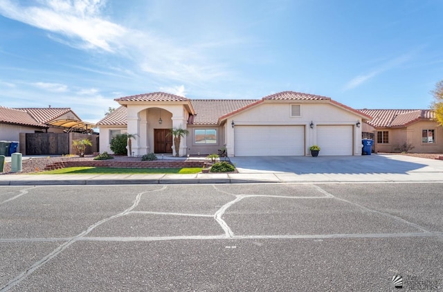 mediterranean / spanish house featuring a garage