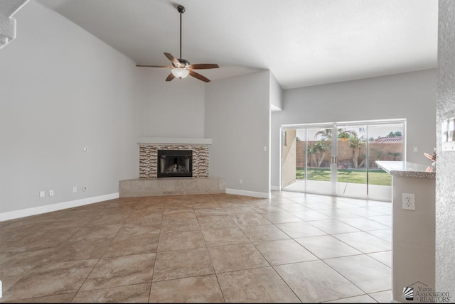 unfurnished living room featuring light tile patterned floors, high vaulted ceiling, and ceiling fan