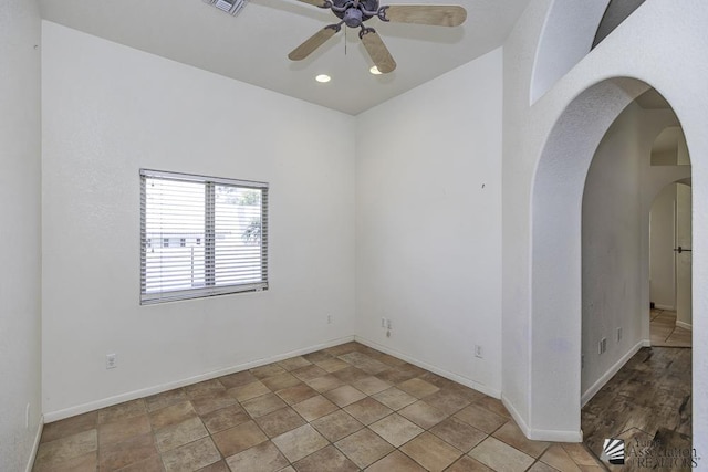 spare room with ceiling fan