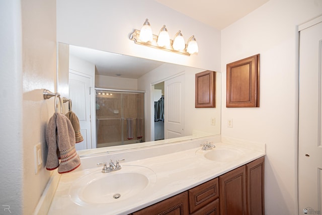 bathroom with an enclosed shower and vanity