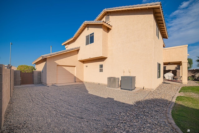 back of house featuring cooling unit