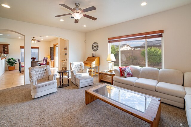 living room with carpet and ceiling fan