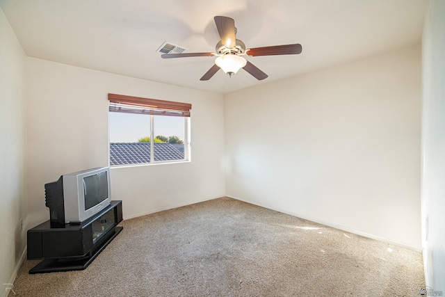 empty room with carpet floors and ceiling fan