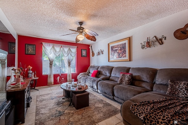 living area featuring light tile patterned flooring, ceiling fan, and a textured ceiling