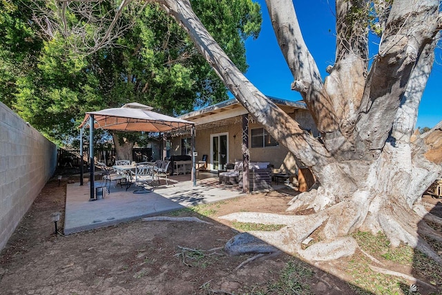 view of yard featuring fence and a gazebo