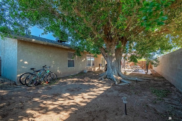 view of yard featuring a patio and a fenced backyard