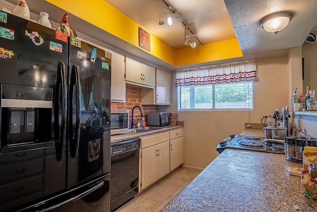 kitchen featuring a textured ceiling, black appliances, white cabinetry, a sink, and light tile patterned flooring