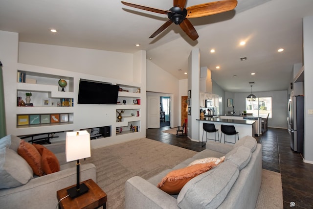 living room with built in features, recessed lighting, baseboards, and high vaulted ceiling