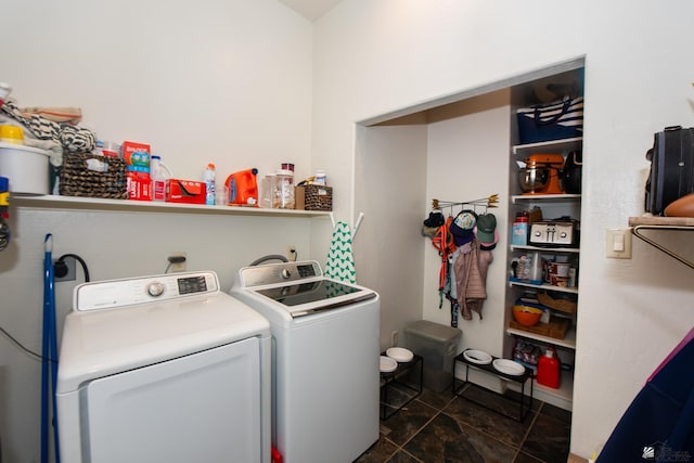 laundry room featuring washing machine and dryer and laundry area