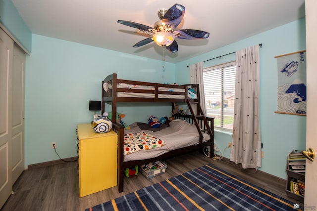 bedroom featuring wood finished floors, baseboards, and ceiling fan