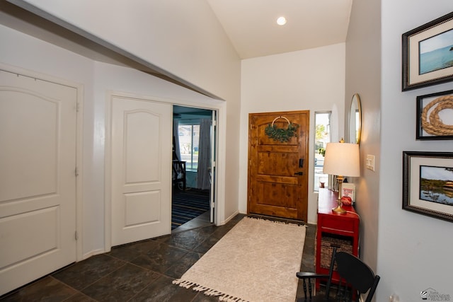 foyer with recessed lighting, a healthy amount of sunlight, and baseboards