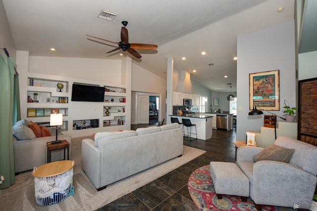 living area featuring high vaulted ceiling, recessed lighting, visible vents, and ceiling fan