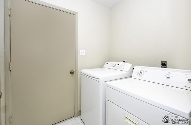 clothes washing area featuring laundry area and washer and dryer