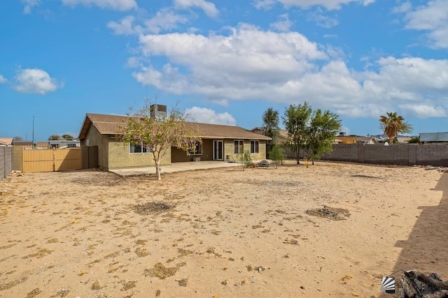 back of property featuring a patio area, a fenced backyard, and stucco siding