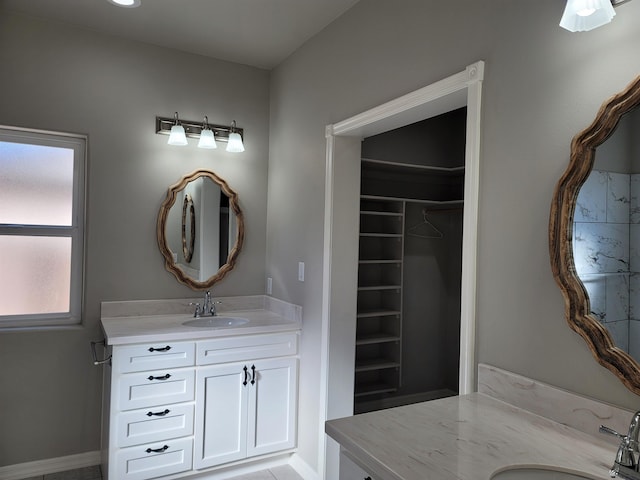 bathroom with tile patterned flooring and vanity