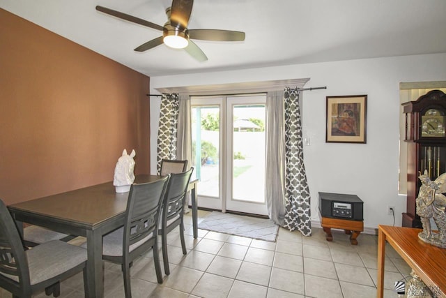 tiled dining room with ceiling fan