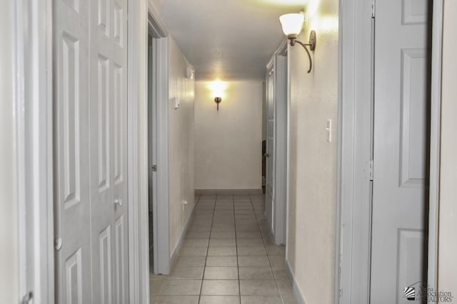 corridor featuring light tile patterned flooring