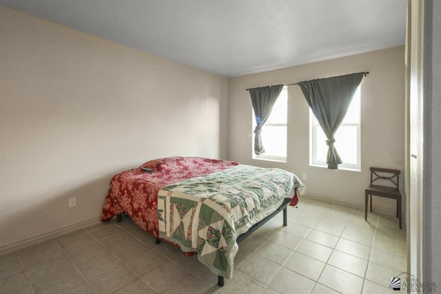 bedroom with tile patterned floors