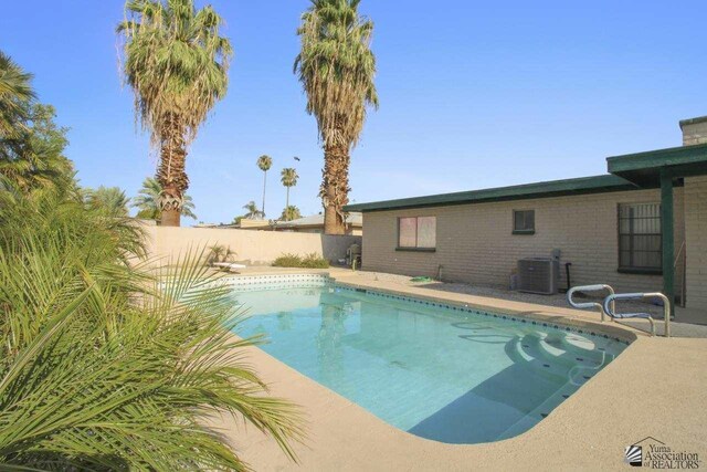 view of swimming pool featuring cooling unit